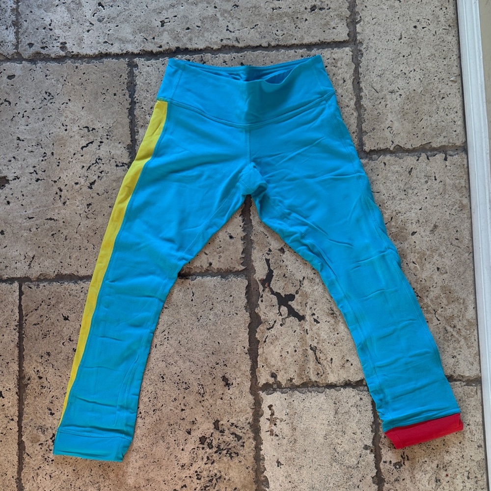 Lulu Lemon cropped Blue Athletic Leggings with Yellow Side Stripe and red stripe